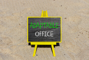 Adaptable office symbol. Concept words Adaptable office on beautiful yellow blackboard. Beautiful sand beach background. Business Adaptable office concept. Copy space.