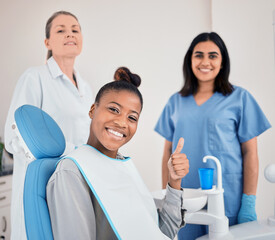 Thumbs up, portrait and oral care with woman for dentist, approval and yes in practice. Happy person, team and dental specialist with ready for consultation, cleaning teeth and wellness on chair