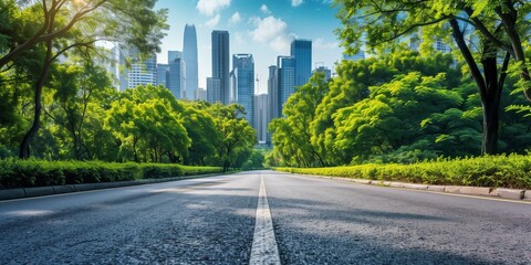 Empty asphalt road leading to city center, A wide empty asphalt road leading to a city center with tall modern buildings and green trees on either side