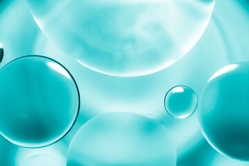 Oil drop background on blue water surface It is natural and abstract.