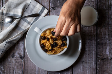 Concept of taking or grabbing food with hands, feminine mature Mexican hands
