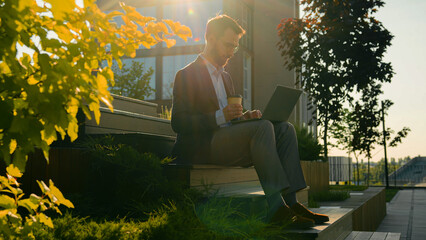 Caucasian business man freelancer work with laptop computer male businessman office worker on steps...