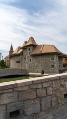 Walking area with shops and restaurants in United Arab Emirates. Riverland, Dubai. Houses in style of medieval Europe. Vertical image