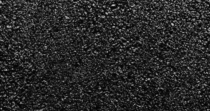 Black sand background. Black sand grunge background. Сlose-up.