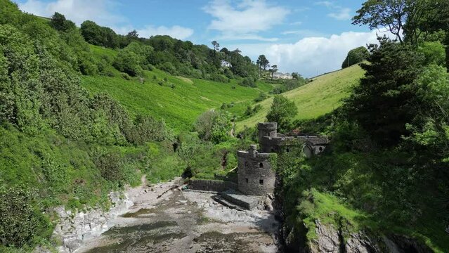 Broadsands, Torbay, South Devon, England: DRONE VIEWS: A farm tractor cuts and levels the grass in a ploughed field. South Devon is an area renowned for arable and livestock farming (Clip 1).
