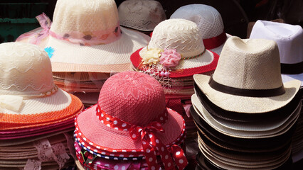 Colorful hats displayed in a street shop