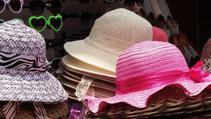 Colorful hats displayed in a street shop