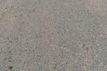 Empty asphalt road, close-up. Car tracks on the asphalt.
