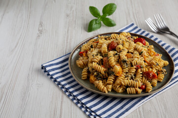 Homemade Baked Boursin Pasta on a Plate, side view. Copy space.