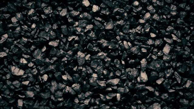 Close-up of a black sand surface moving.