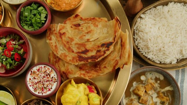 Savor a flavorful bowl of delicious spicy curry, ready to be enjoyed with a spoon