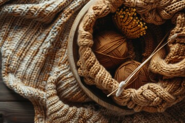 A Basket of Warmth: Golden Yarn Balls and Knitted Fabric Ready for a Cozy Project
