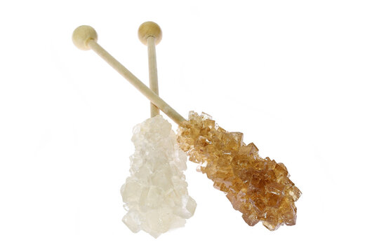 brown and white rock candy sticks isolated on white background