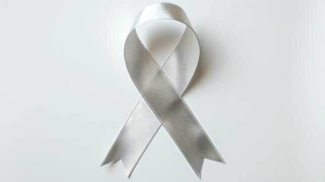 A silver ribbon standing out against a white background with a clipping path symbolizes support for Parkinson s disease and raising awareness about brain cancer tumors