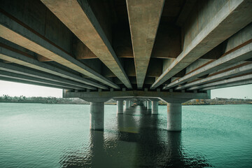 the bottom of a bridge or bridge support pillars that are in water