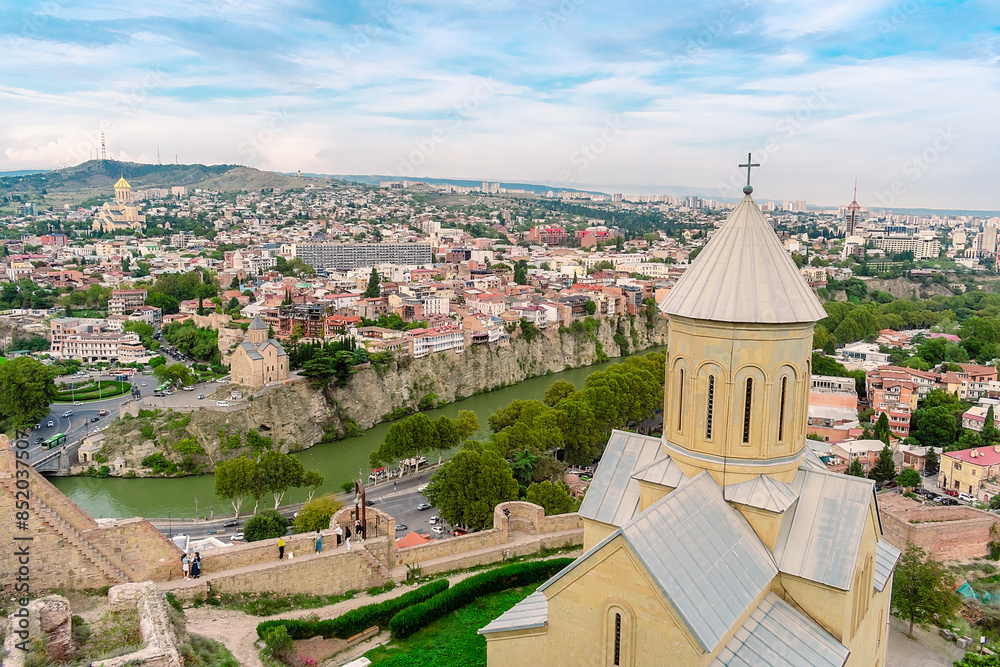 Wall mural Church of St. Nicholas in Tbilisi, Georgia. View of the Georgian city of Tbilisi and the Church of St. Nicholas from a high point.