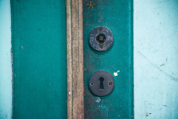 broken or damaged ancient wooden keyholes and handles on wooden doors