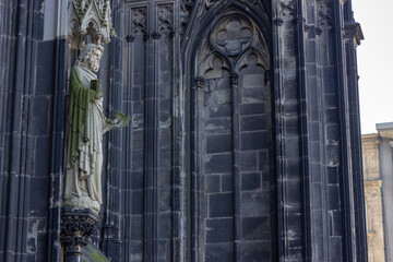 Statue of apostle Jude Thaddeus at the entrance of the Hohe Domkirche St. Petrus (Cologne Cathedral) in Cologne, Germany