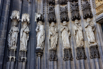Ornate statues of biblical figures at the entrance of the Hohe Domkirche St. Petrus (Cologne Cathedral) in Cologne, Germany