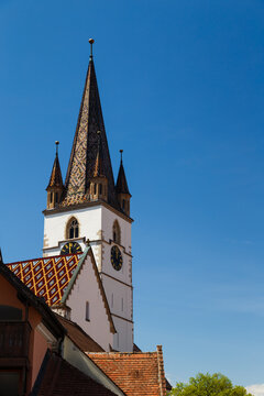 The clock tower of Sibiu Lutheran Cathedral of Saint Mary or Catedrala Evanghelica Sfanta Maria, historical center of Sibiu, Transylvania, Romania