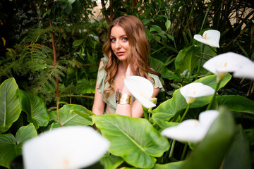 Collage with young beautiful woman with long brunette hair and natural makeup expressing different emotions with plant, calla flower over white background