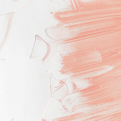 Light abstract background with chaotic strokes of peach paint.