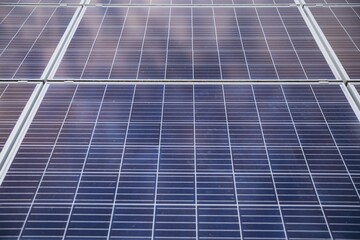 Close-up of Solar cell farm power plant eco technology. Landscape of Solar cell panels in a photovoltaic power plant. Concept of sustainable resources and renewable energy.