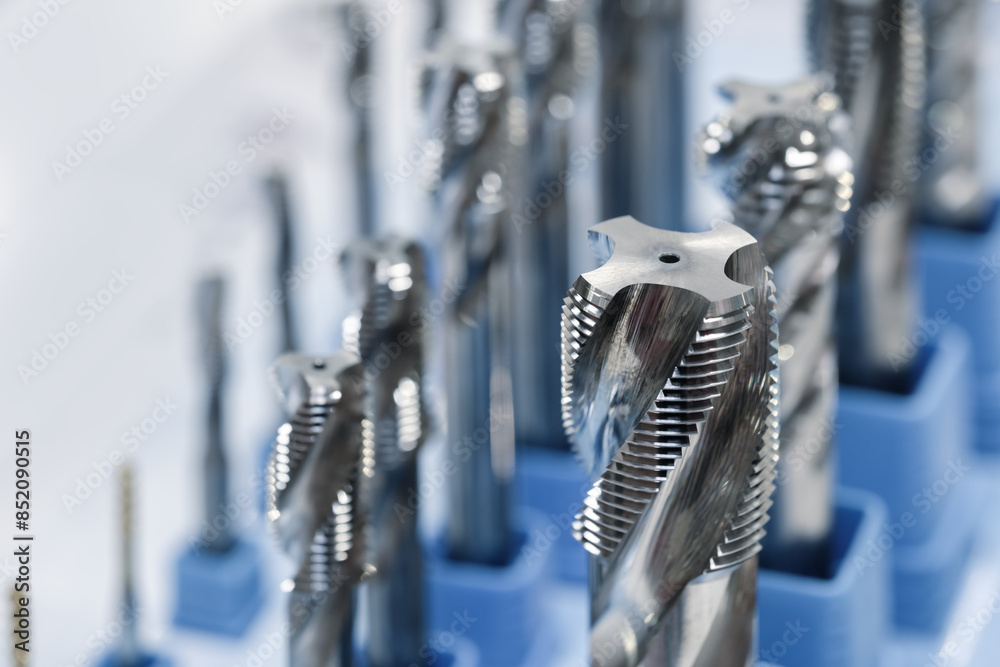 Poster a close up of many different shaped metal tools. the tools are all different sizes and shapes, but t