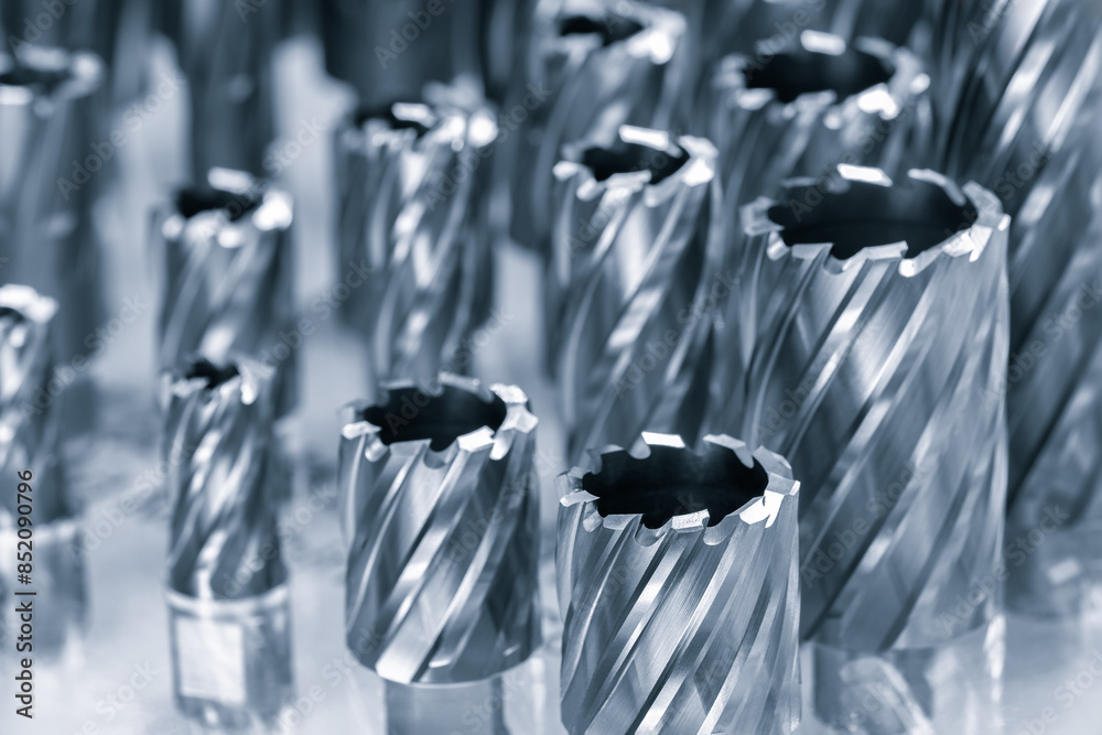Poster A close up of many different shaped metal tools. The tools are all different sizes and shapes, but they all have a similar design. Concept of precision and attention to detail