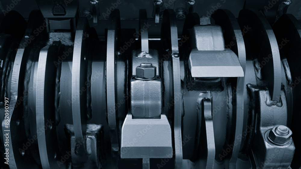 Poster a close up of a machine with a black and silver color scheme