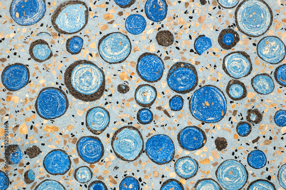 Poster A blue and white pattern of circles is on a surface. The circles are of different sizes and are scattered throughout the image. Scene is calm and serene, as the circles seem to be floating in the air