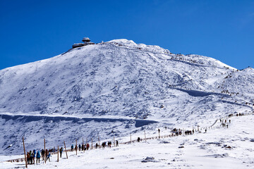People and tourist hostel on top of Sniezka in the Giant Mountains