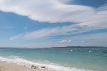 Seascape, picturesque sky with clouds over a stormy sea, beach in Croatia on a sunny day