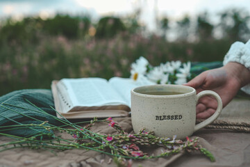 Cup of BLESSED in hands, good morning, Christian concept