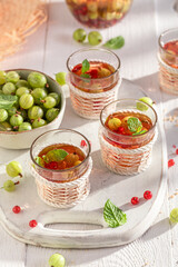 Healthy lemonade made with ice and fresh fruit.