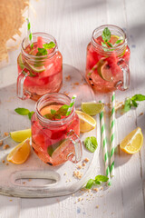 Healthy and tasty lemonade with fruits and crushed ice.