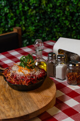 Gourmet Skillet Lasagna Served on Red Checkered Tablecloth