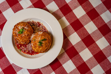 Top View of Arancini on Checkered Tablecloth