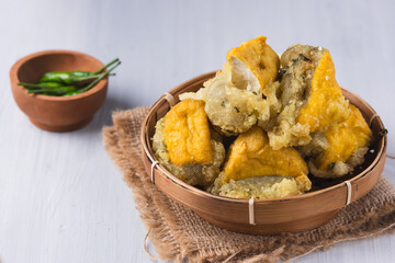 tahu aci or tahu kiwil or Tofu aci is typical Tegal culinary dish made from tofu, aci or tapioca and spices and Then fried until crispy. Perfect for recipe, article, or any cooking contents.