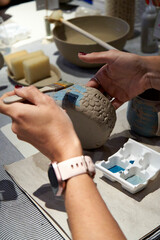 shape clay with hands