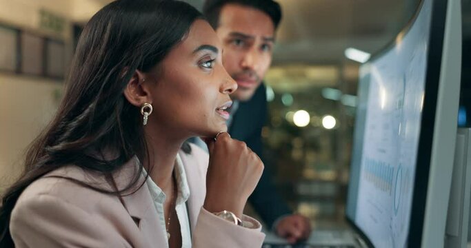 Office, man and woman consulting at computer with advice, teamwork and brainstorming together for online stats. Help, problem solving and business people at desk with data analytics, mentor or night