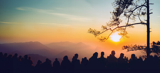 People watching Sunrise in the morning. Tourists travel relax in the holiday. photograph sunrise in...