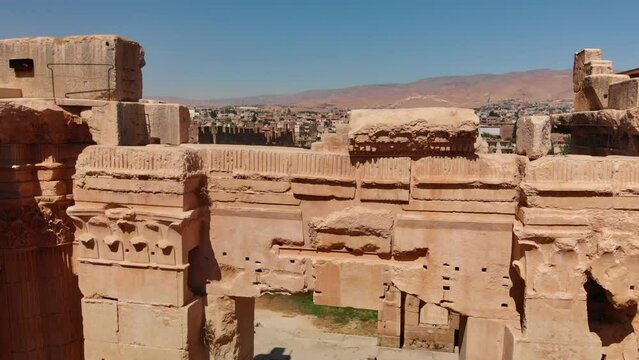 A shot of the ancient archaeological wonder Roman ruins at Baalbek, a UNESCO World Heritage site in Lebanon's Bekaa Valley. Towering columns, intricate stonework.