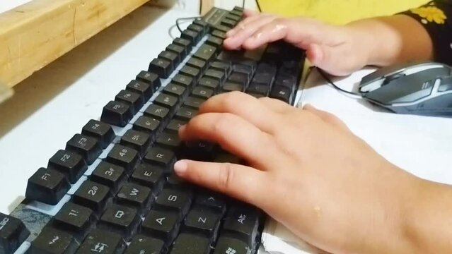 Close-up of the hands of a freelancer working on a laptop in a private room