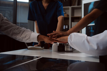 Doctor handshake and partnership in healthcare, medicine or trust for collaboration, unity or support.Team of medical experts shaking hands in teamwork for or success in hospital