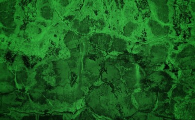 The background is made of green patterned concrete. Dark abstract green stone concrete paper texture background panorama banner long, with space for text