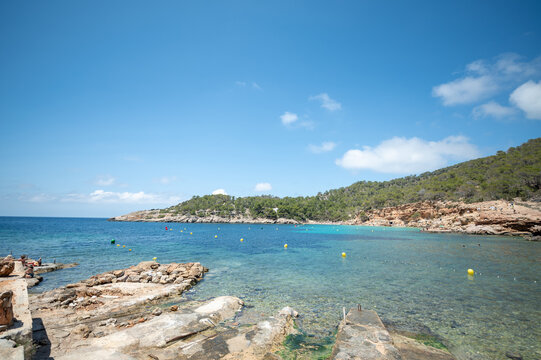 People on the beach of Cala Salada in Ibiza in summer 2024. in Ibiza in summer 2024.