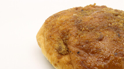 Delicious bread with shredded topping isolated