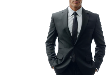 Professional businessman in a dark suit and tie, confidently posing with hands in pockets against a white background.