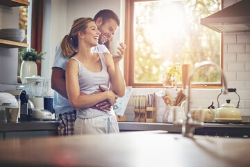 Coffee, hug and romance with couple in kitchen of home together for morning break or wellness. Cup, relax or smile with happy man and woman drinking fresh beverage or tea in apartment for love